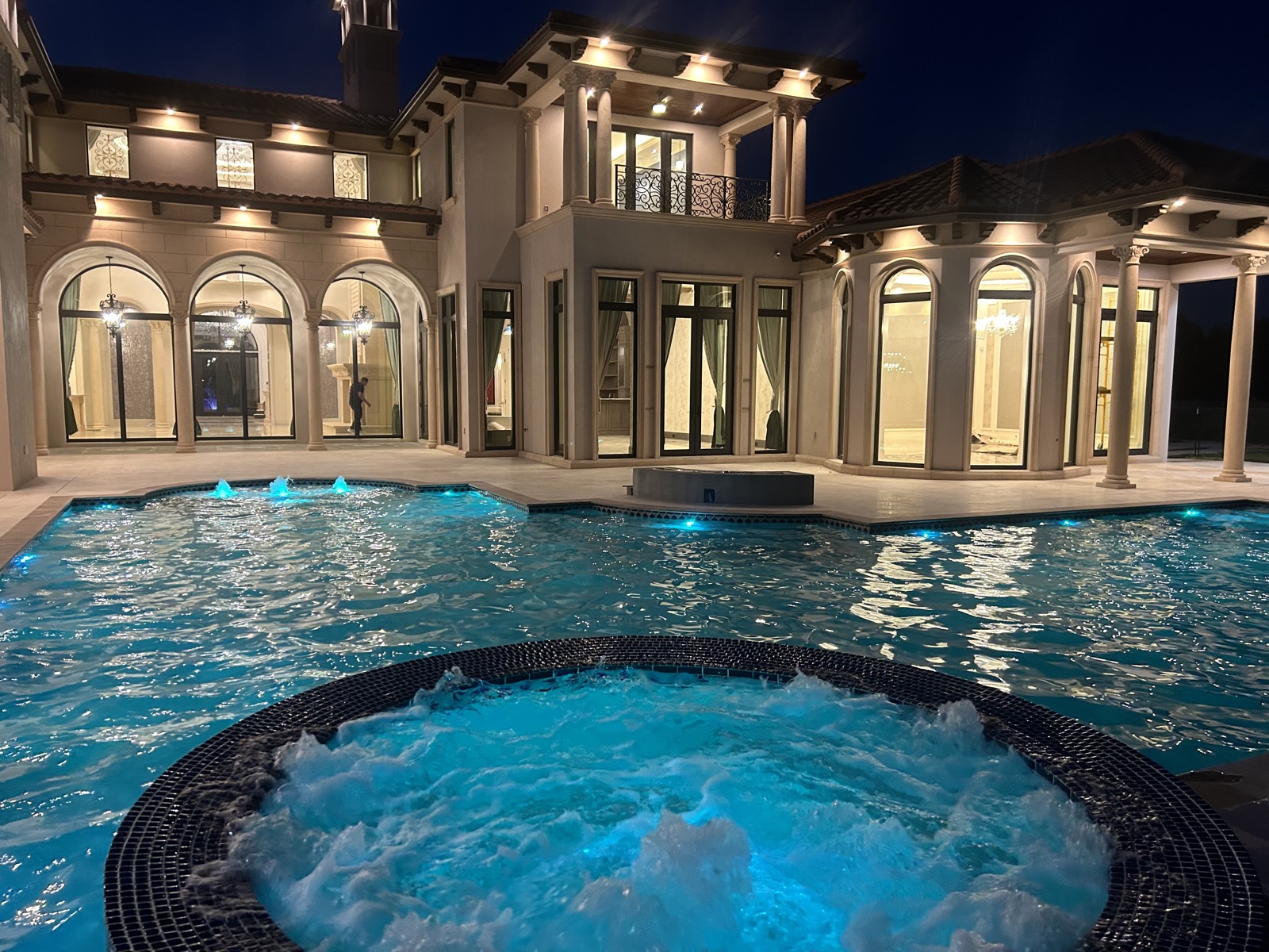Pool and spa with color LED lighting at a South Florida home
